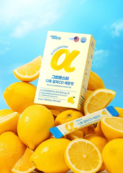 A high-key product showcase featuring the supplement packaging surrounded by fresh lemons against a bright blue sky.